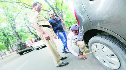 Action has been taken against 5,000 vehicles flouting parking rules in seven days: Minister. ( Source: Express archive )