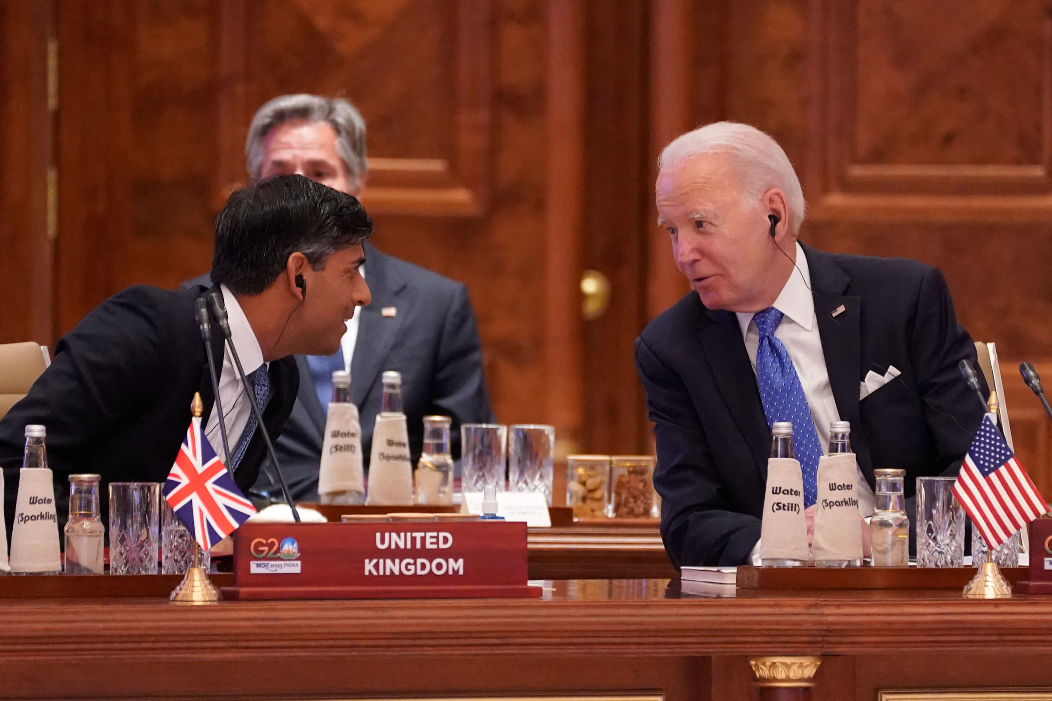 British Prime Minister Rishi Sunak, left, talks with US President Joe Biden during the first session of the G20 Summit, in New Delhi. AP photo