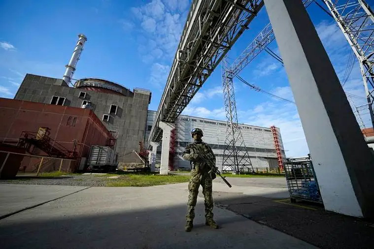 A Russian serviceman guards an area of the Zaporizhzhia Nuclear Power Station in territory under Russian military control, southeastern Ukraine, May 1, 2022. (AP)